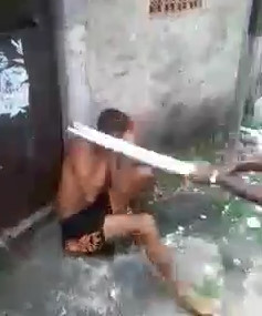 Thief Being Punished with Stick Blows in Favela ghetto