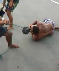 Thief Tied to the Neck being Dragged and Beaten after Being Caught Stealing