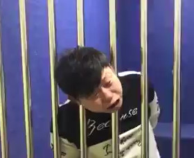 Man`s head is stuck in bars inside police station 