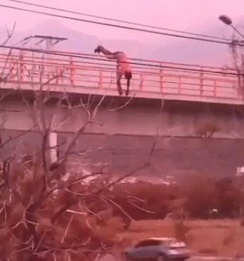 Deranged Man Dives Onto a Highway