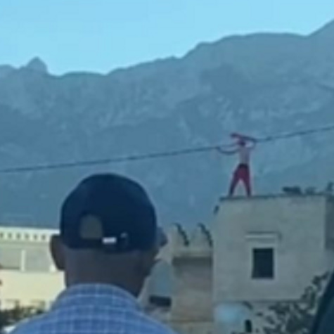 Mentally Ill Man Waving The Flag Before Jumping To Death In Morocco
