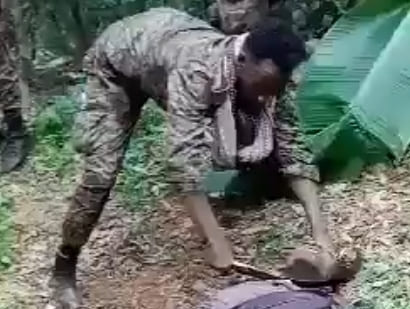 Ethiopian Soldier Slits Civilians Throat With Sickle.