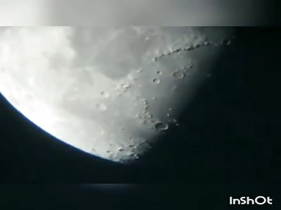 UFO flies over Moon, casting a shadow on it