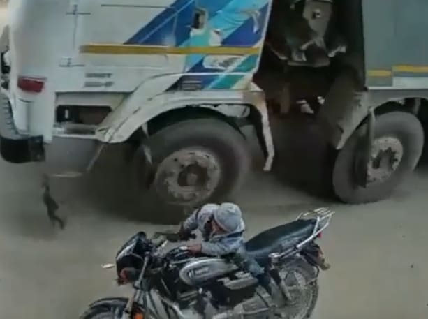 Kid Falls Under The Wheels Of Garbage Truck