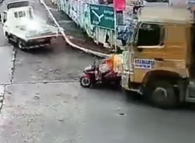 Guy On Bike Flattened By Dump Truck