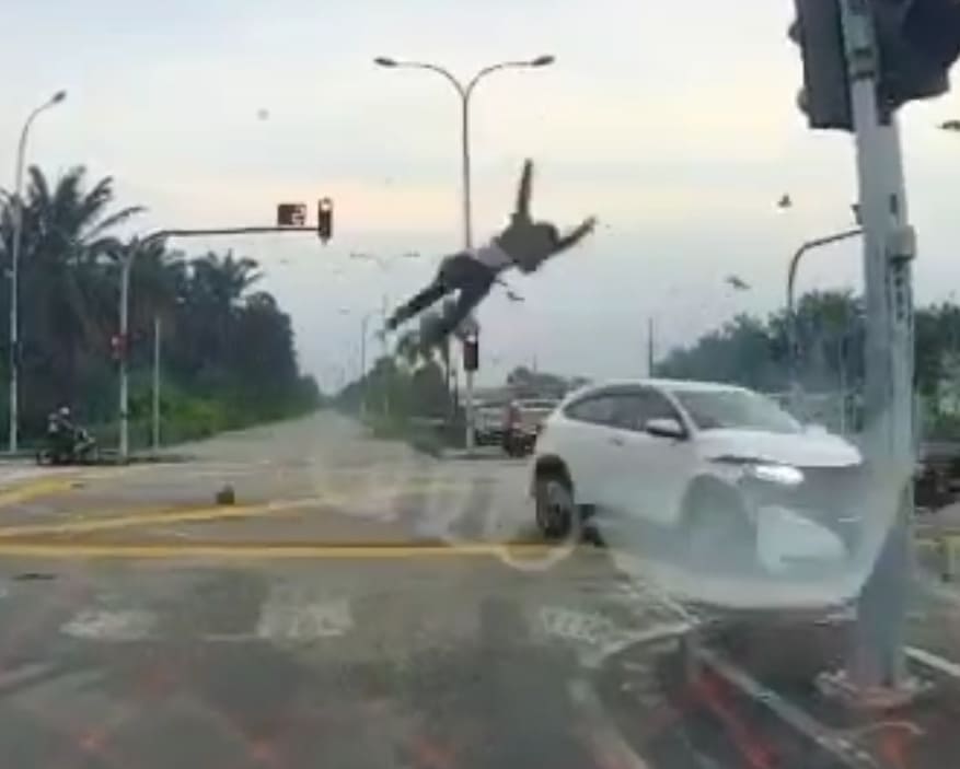 Biker Takes Flight At Intersection 