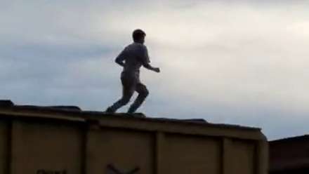 Guy Running On Top of Moving Train Beheaded