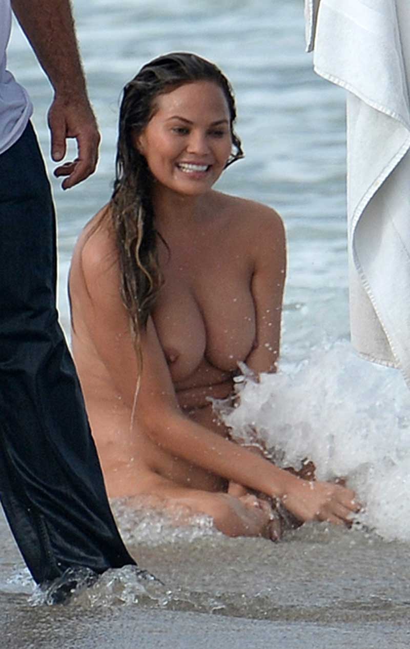 Chrissy Teigen Naked as Fuck on Beach ... Tits Look Nice