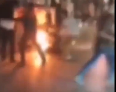 Iranian Police Officer Set on Fire During Massive Rioting.