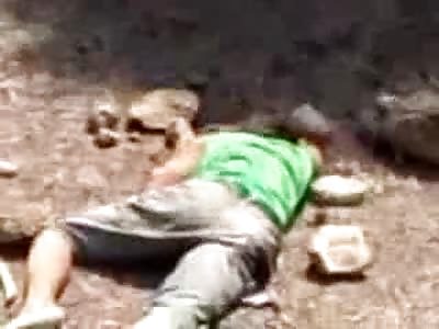Man is Violently Stoned to Death by Murdeous Mob, turned over to see his Guts Hanging Out