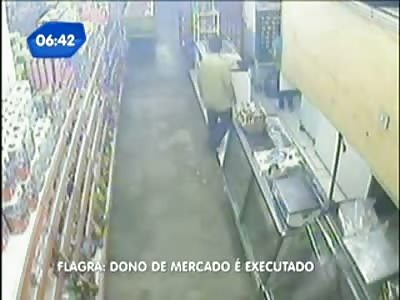 CCTV Footage of Store Owner Brutally Gunned Down trying to Fight Off a Robbery (green shirt)