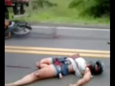 Chubby Female Biker lies Dead next to Her Flaming Motorcycle