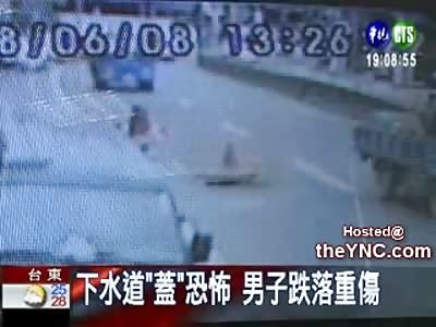 Biker hits a Manhole in the Middle of the Expressway, Jumps inside of it to Avoid being Hit by a Truck