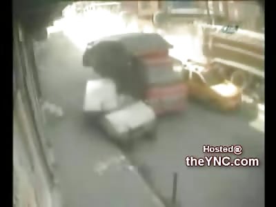 Woman watching Accident is Flattened by Dump Truck (Watch Woman on the Same Side as the Street Sign I have Circled in Red))