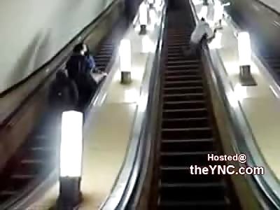 Drunken Moron Falls Down Escalator Cracking His Skull Against Light Shattering it