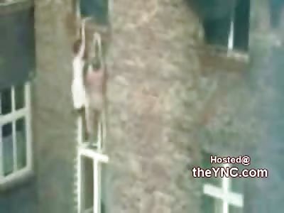 Naked Man and His wife Hang out of their Bedroom Window as Fire Rages
