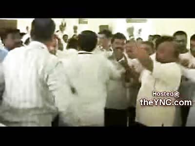 An India Congressman  Beaten with Chairs and Kicked by Rivals at a Meeting in India