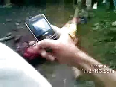 Barbaric Murder: Man Stoned to Death on Street by Town (Still Alive and moving and Pointing at 2:15 of Video) 