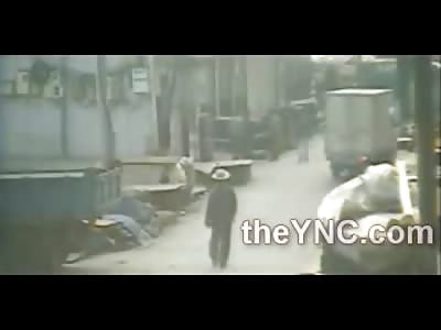 How the F*ck??  Man walks right into a Truck Backing Up at High Speed