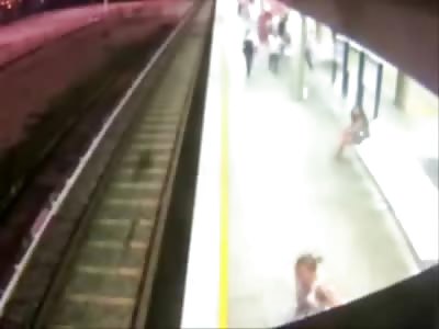 Crazy Woman pushes Female onto Train Tracks in Attempted Murder caught on Tape
