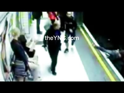 Asshole pushes Female onto Subway Train Tracks