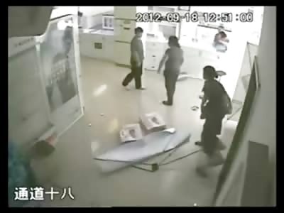 Man Beats the Living Shit out of a Woman in a Photo Store