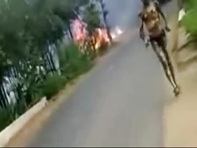 Alien Looking Being walks Away from Burning Hell in India