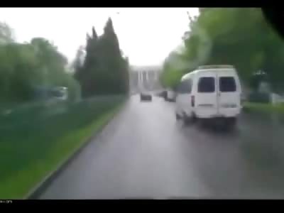 POV: Woman is Blasted Crossing the Street on a Rainy Day