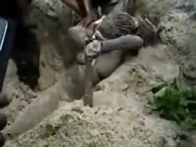 Naked Nigerian Woman is pulled out of Shallow Grave..She was Buried Alive