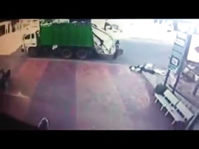 Garbage man Worker is Crushed to Death in between Industrial Truck and the Garbage Truck