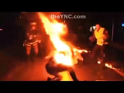 Man lights himself on Fire in Protest and sets the Cop on Fire while hes at it 
