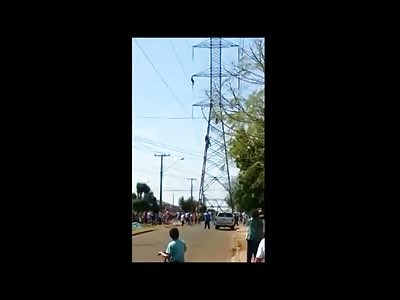 Crazy Man climbs Electric Tower and Jumps to his Death Hitting Power Lines on the Way Down (New) 