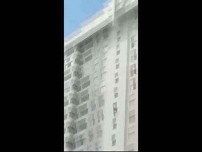 Teenager Dangles from Building then Lets Go....Suicide caught on Camera 