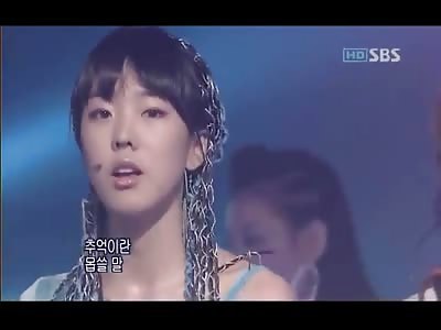 Background dancer has an epileptic seizure but the group continues the performance
